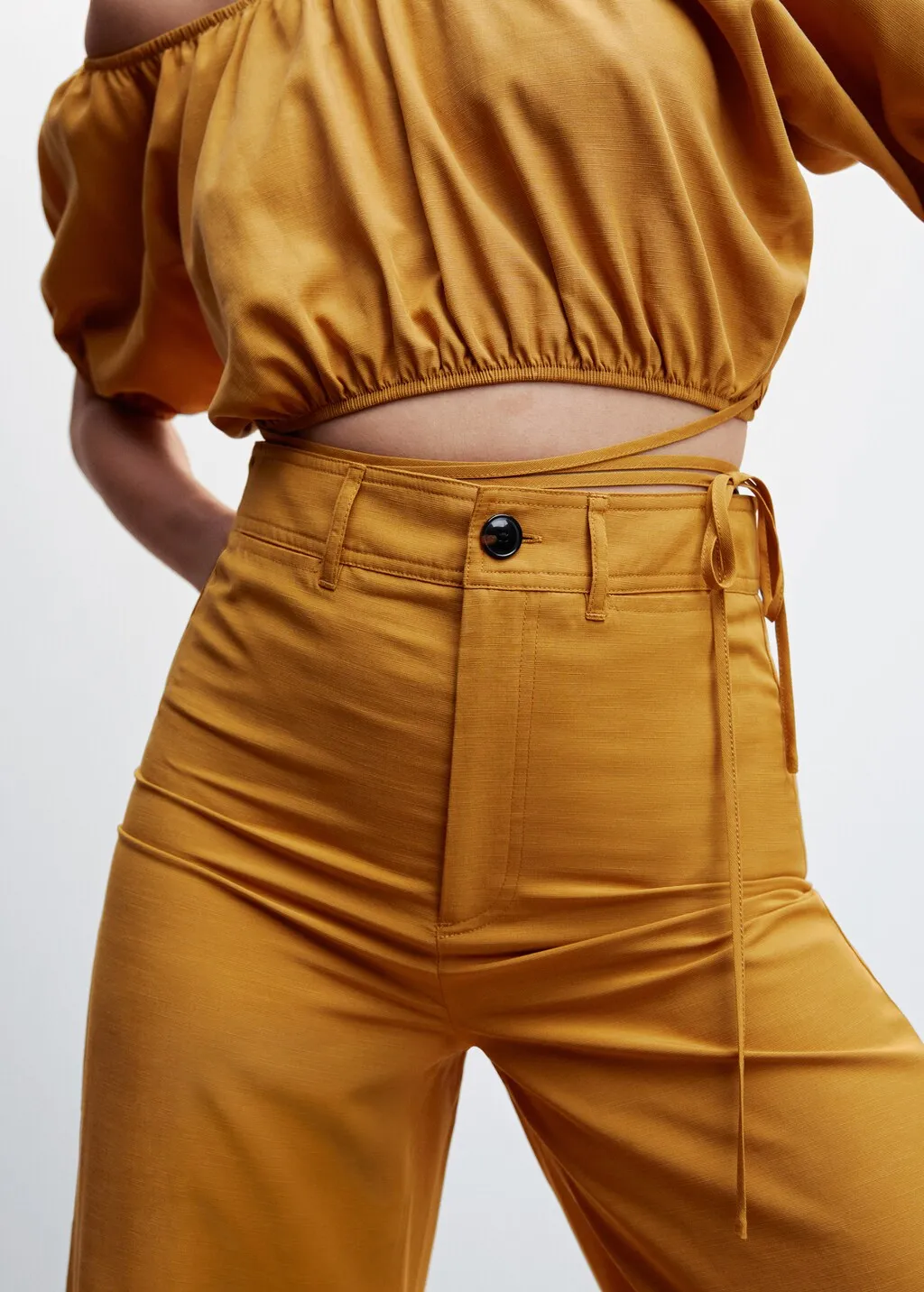 Pantaloni crop vita alta